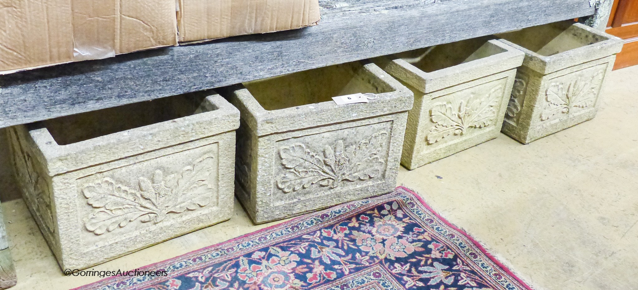 A set of four garden planters moulded with oak leaves and acorns, width 37cm, depth 37cm, height 27cm